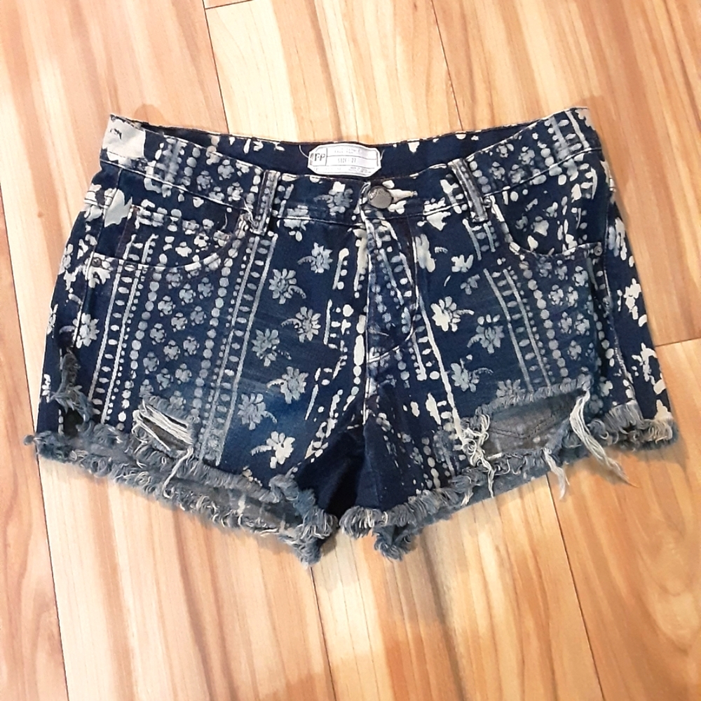 Free People Floral Bleach Print Distressed Button Fly Denim Shorts.